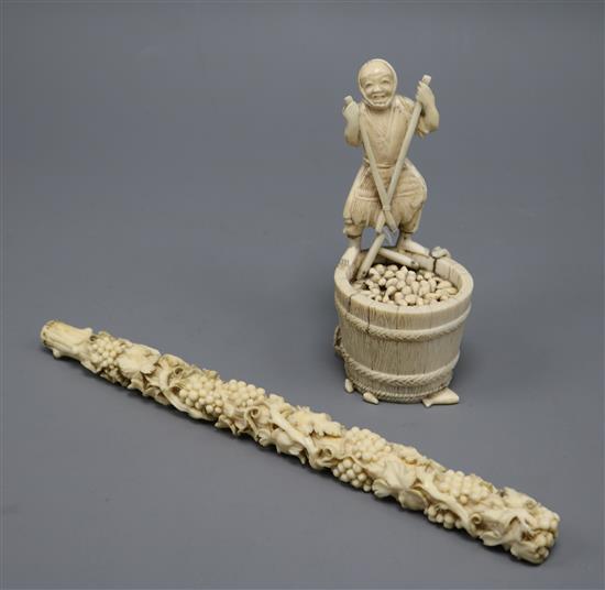 A Japanese ivory figure and a similar parasol handle handle length 23.5cm
